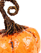 Paper mache pumpkin by sculpture artist Jessica Dvergsten in orange for Halloween and Thanksgiving.